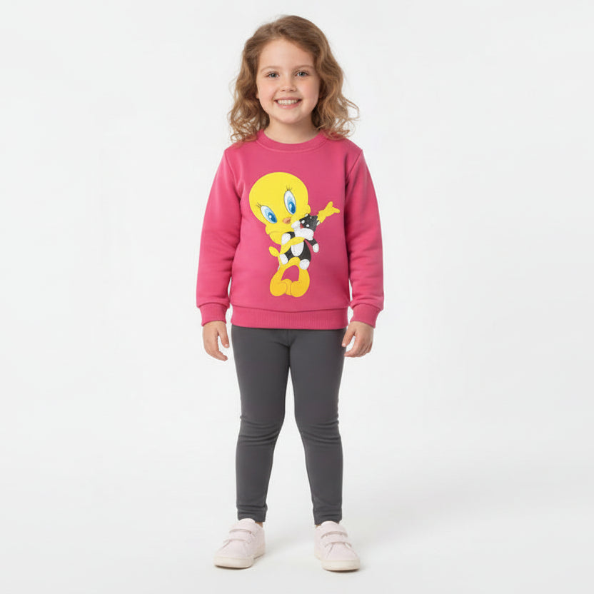 Child wearing a pink sweater with a cartoon character on a white background