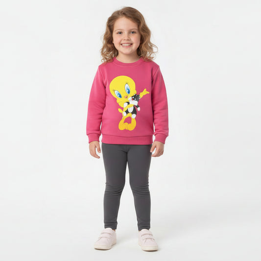 Child wearing a pink sweater with a cartoon character on a white background